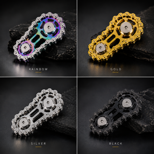 Four product variants of a motorcycle chain drive sprocket shown in a 2x2 grid, each labeled with a color name: RAINBOW, GOLD, SILVER, and BLACK. The sprockets are displayed on dark textured rocks against a dark studio background.